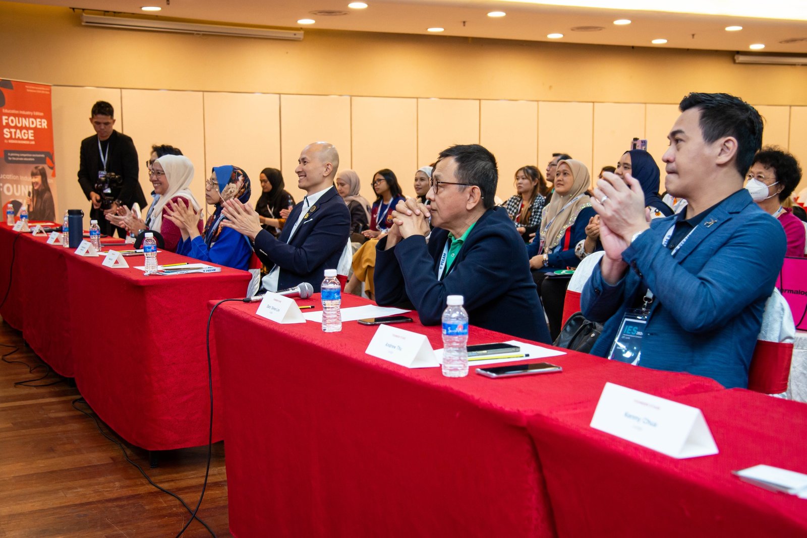 Business leaders and delegates attending an industry discussion